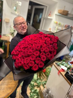 Large rose bouquet made of fresh red roses, hand-tied by Flowerpower Graz, regional and made with love.